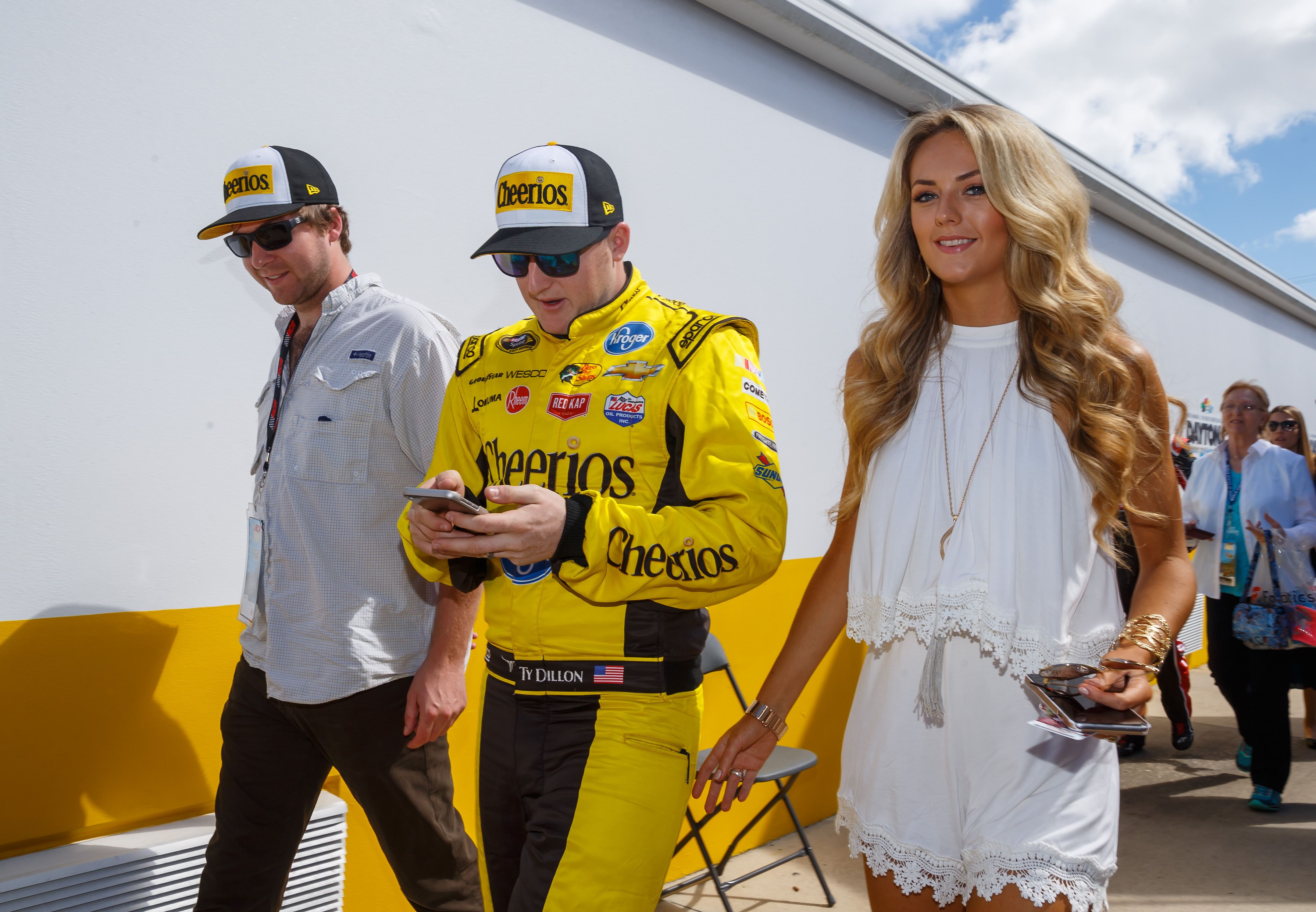  Ty Dillon (center) with wife Haley before the Daytona 500 at Daytona International Speedway. (Source: Imagn)