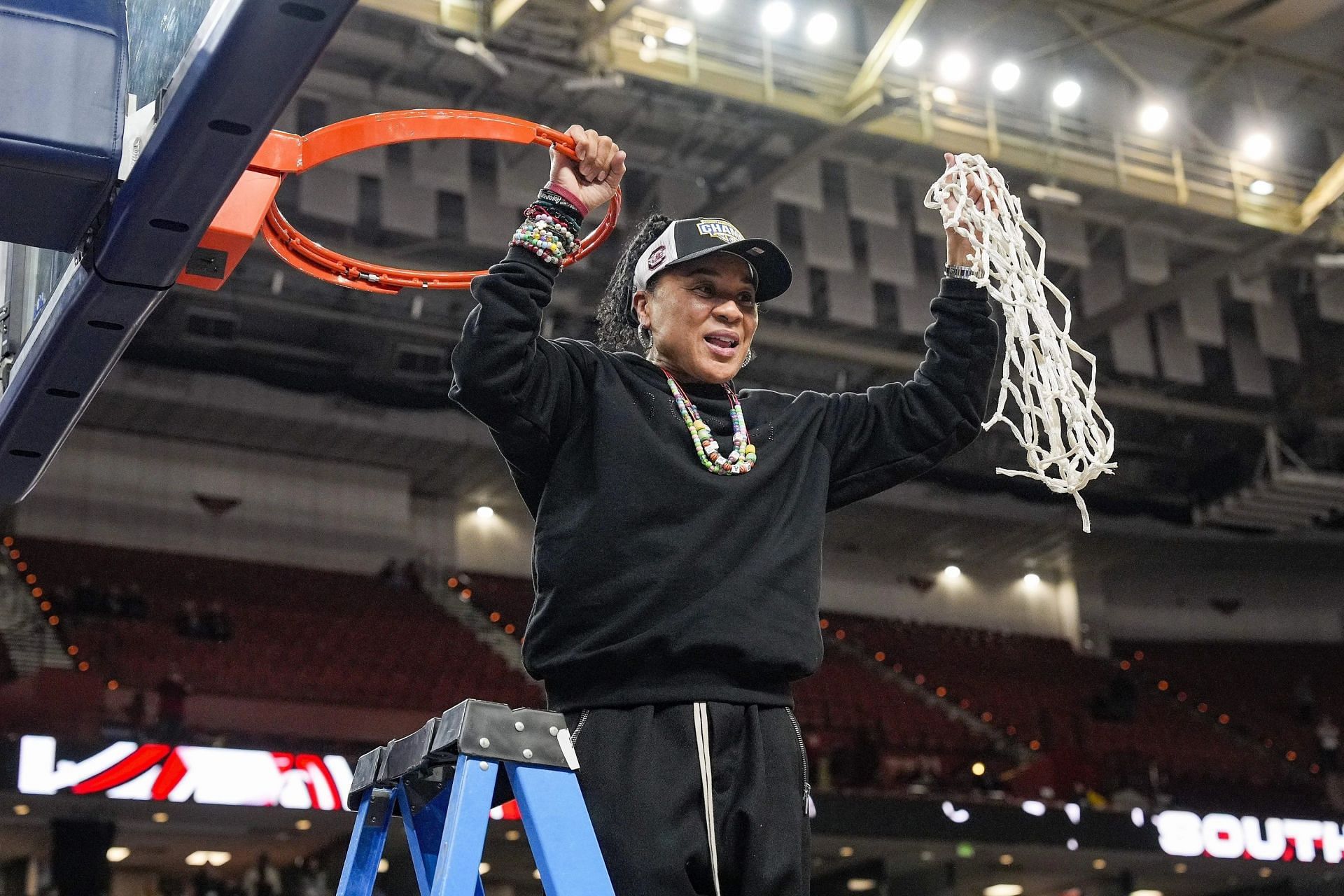 Dawn Staley cuts the net after winning SEC Tournament (Image Source: Imagn)