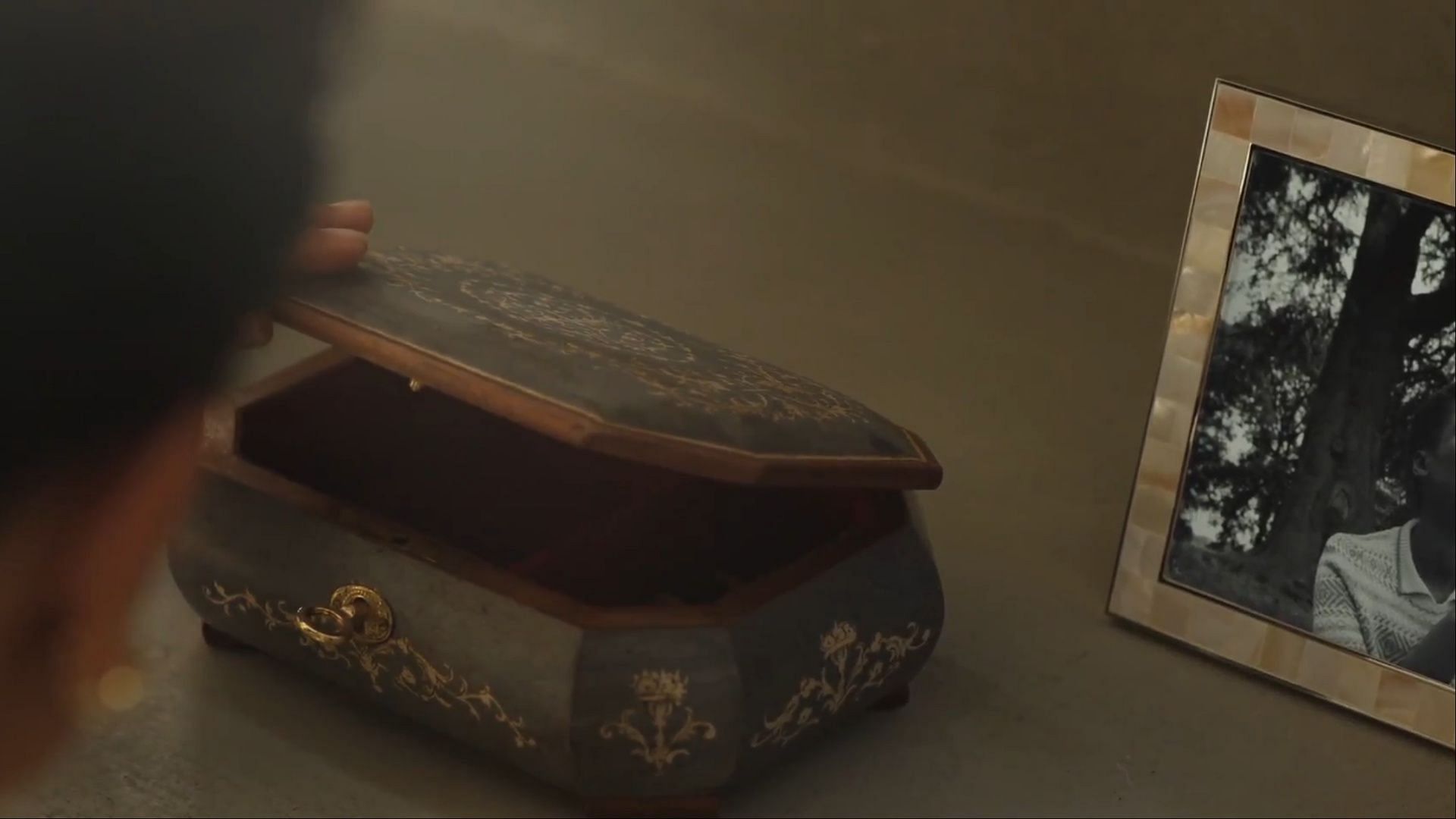 Music box discovery in Surface season 2 episode 4 - Sophie finds a music box that raises questions about her connection to the Huntley family. (Image via AppleTV+)