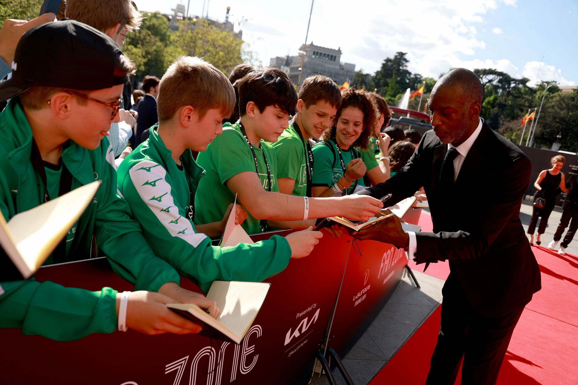 Johnson signing autographs for his fans during the Red Carpet event of the 2024 Laureus Awards in Madrid (Image via: Getty Images)