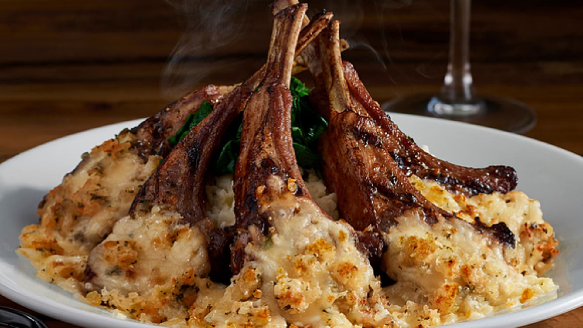 The grilled lamb chops with Parmesan and Garlic Cheese blend (Image via LongHorn Steakhouse)