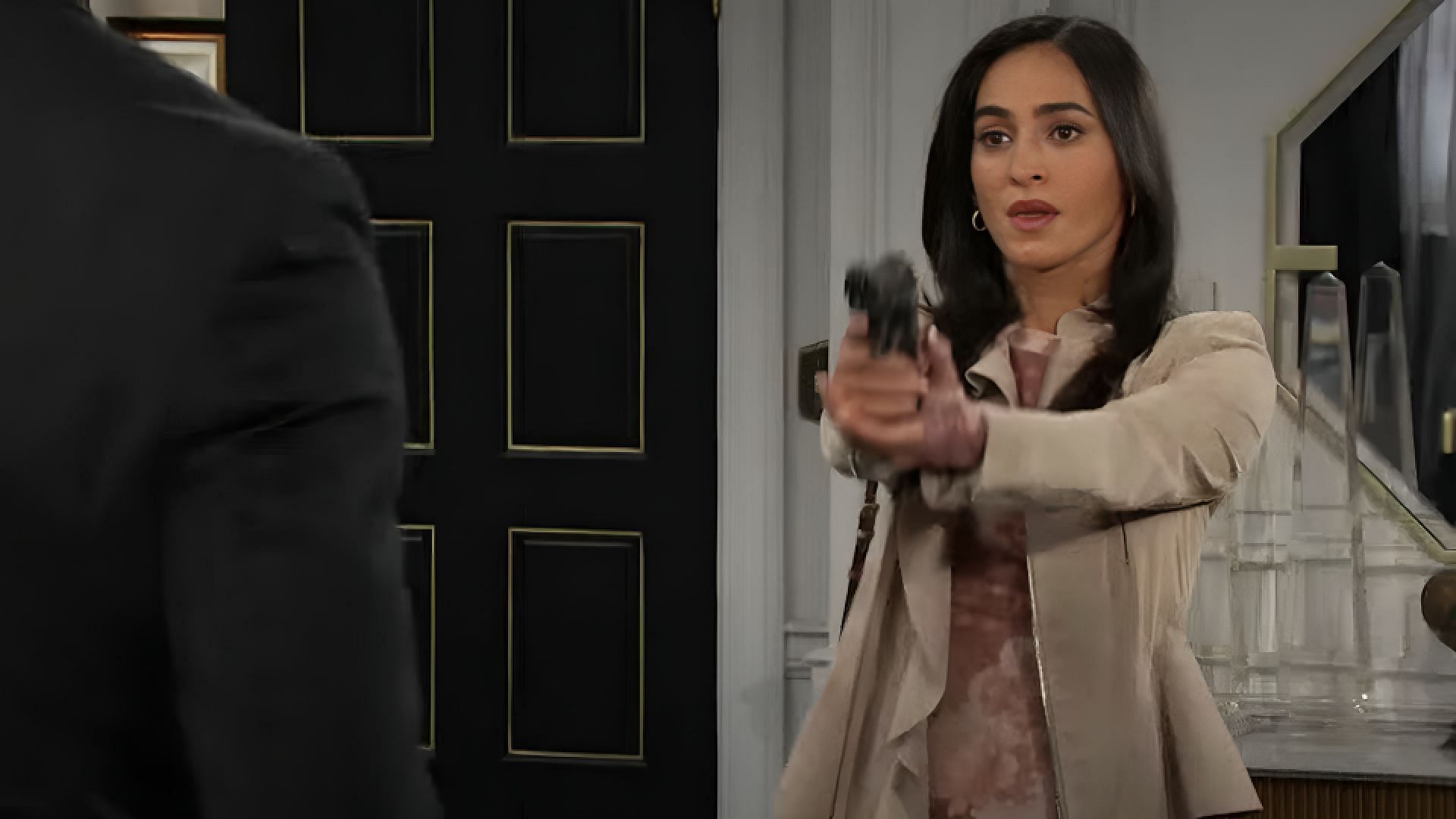 Gabi holding a gun at EJ (Image via Youtube /  Days of our Lives)