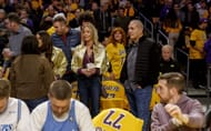 Lakers guard Luka Doncic's (77) T-shirts are draped over seats for fans to wear near Lakers owner Jeanie Buss, middle, wearing gold jacket, before the game against the Utah Jazz on February 10, 2025 - Source: Getty