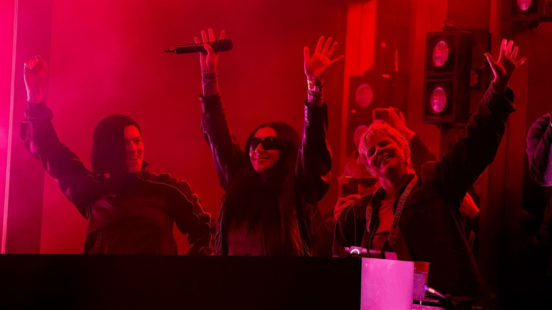 Romy, Charli XCX, and Robyn perform during day three of the Glastonbury Festival 2024 at Worthy Farm, Pilton on June 28, 2024. (Image via Getty/Joseph Okpako)