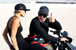 Tony Stewart joins wife Leah for a selfie at fan meetup ahead of 2025 NHRA Gatornationals