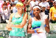 Maria Sharapova (L) and Serena Williams with their Miami Open 2013 trophies - Source: Getty