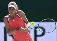 Yastremska of Ukraine plays a backhand in her match against Iga Swiatek of Poland at Indian Wells - Source: Getty