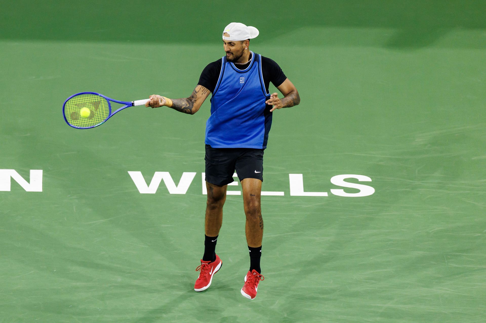 Nick Kyrgios hits a forehand in Indian Wells | Image Source: Getty