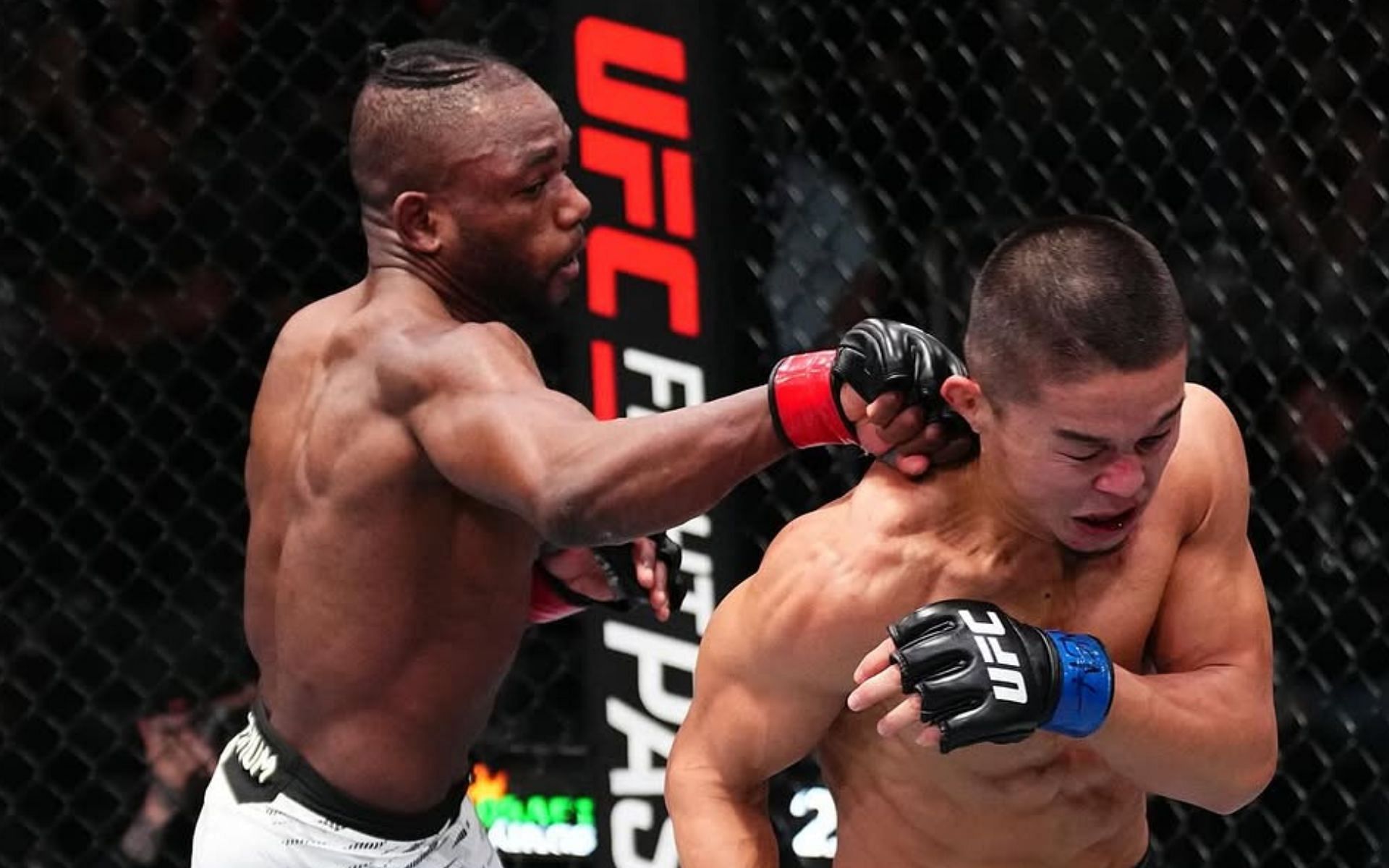 Manel Kape (left) chasing his opponent Asu Almabayev (right) across the cage. [Image courtesy @ufc on Instagram]