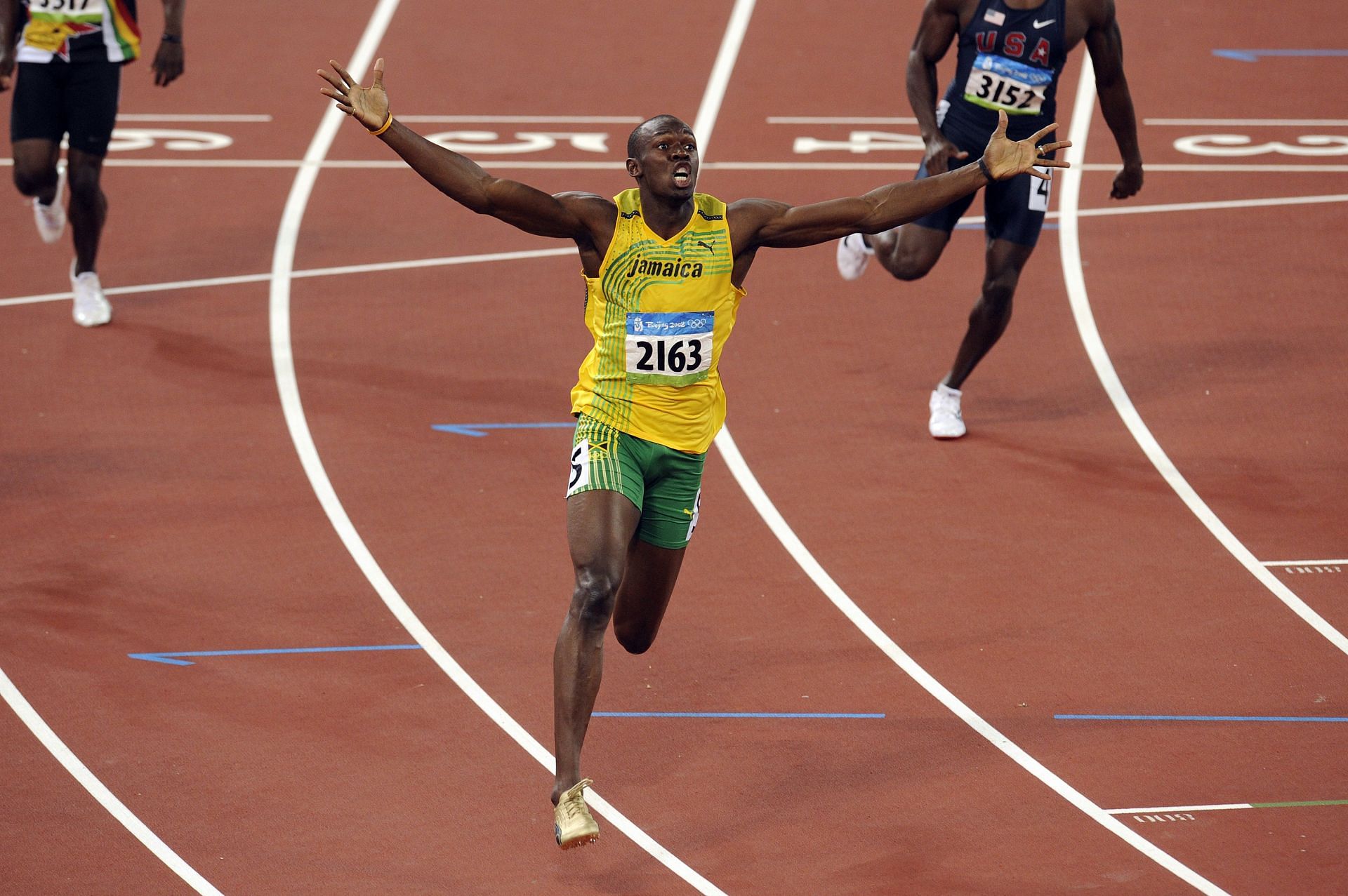 Usain Bolt celebrates after winning the 200m race during the 2008 Beijing Olympics (Image via: Getty Images)