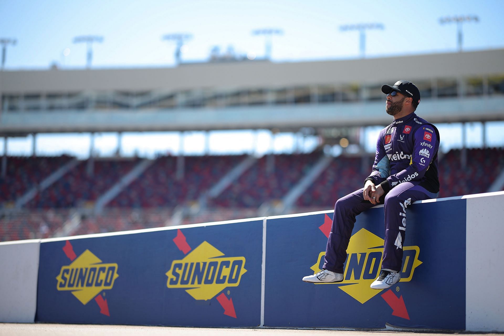 Bubba Wallace waits on the grid during practice for the NASCAR Cup Series Shriners Children