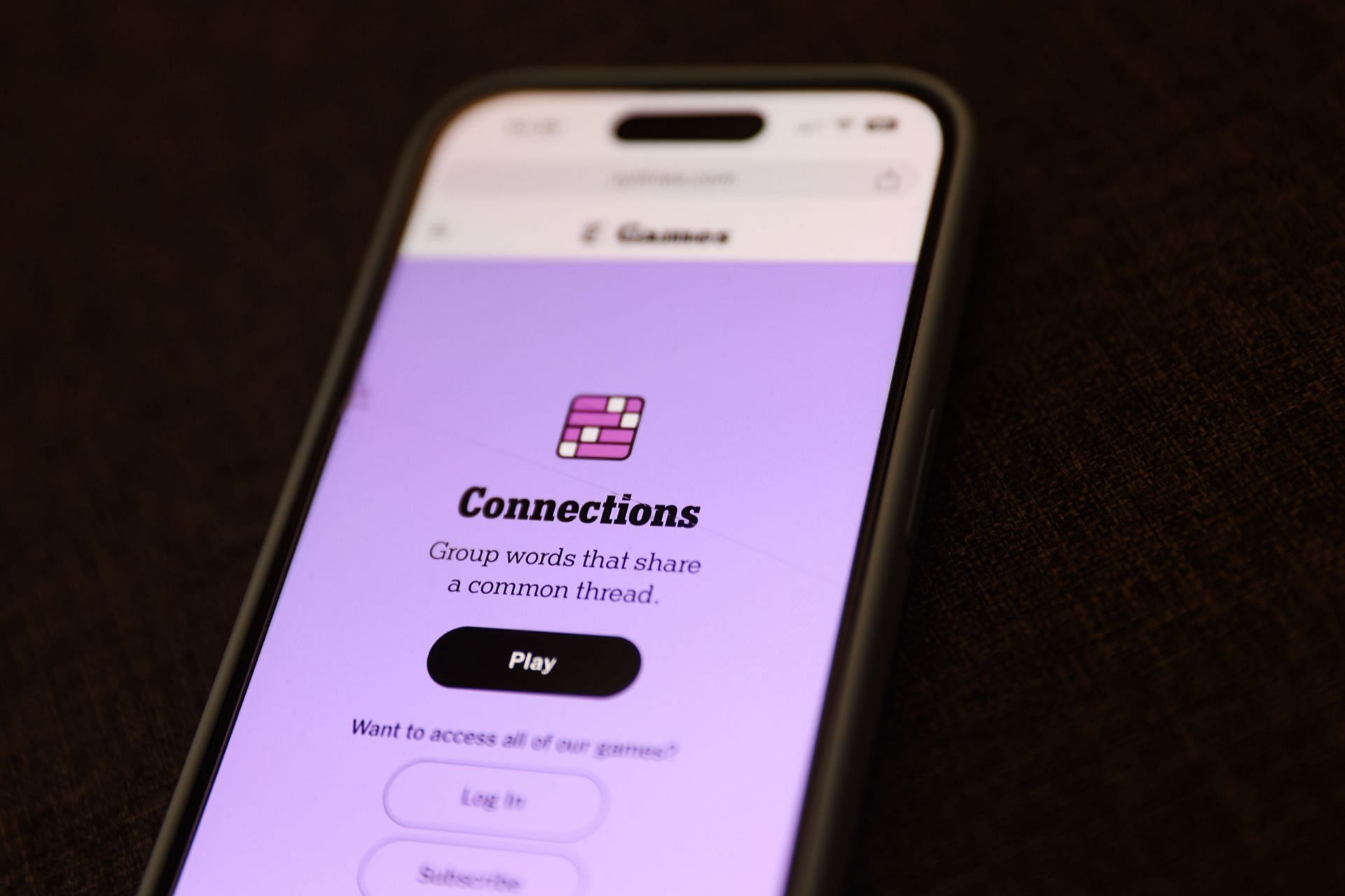            Connections game displayed on a phone (Image via Getty)