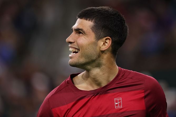 WATCH: Carlos Alcaraz teases extreme Indian Wells conditions as he signs the camera after braving the wind against Grigor Dimitrov