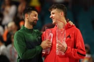 Jakub Mensik (R) pictured with Novak Djokovic at the 2025 Miami Ope - Image Source: Getty