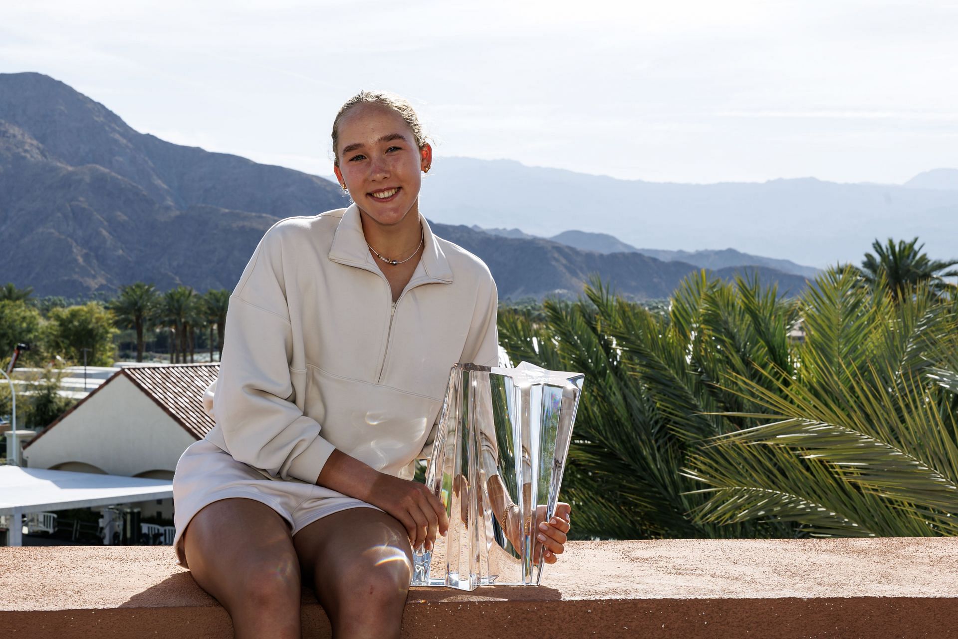 Mirra Andreeva poses with the 2025 BNP Paribas Open women&#039;s singles trophy (Source: Getty)