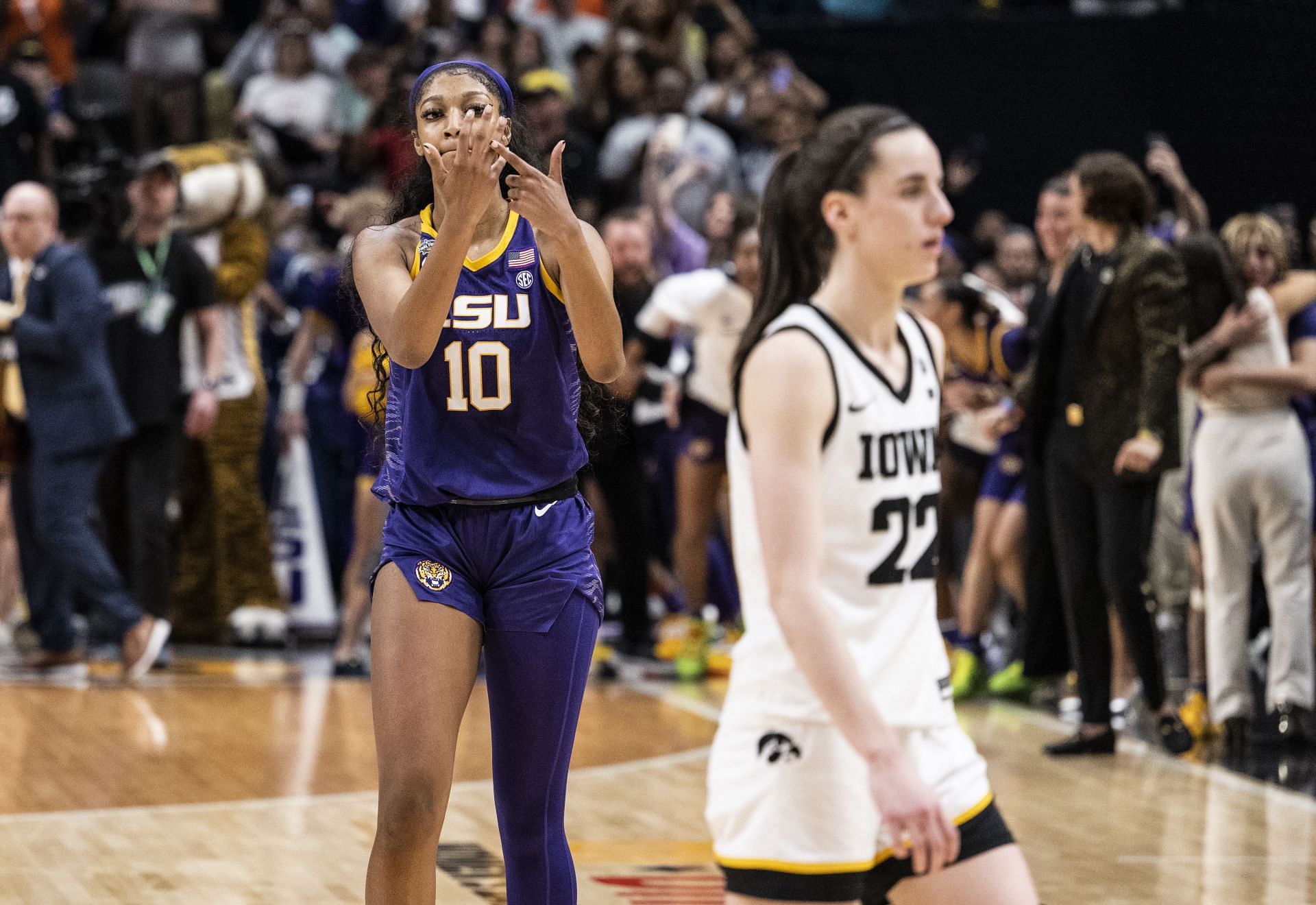 Angel Reese #10 of the LSU Lady Tigers reacts in front of Caitlin Clark #22 of the Iowa Hawkeyes towards the end of the 2023 NCAA Women&#039;s Basketball Tournament championship game at American Airlines Center on April 02, 2023. - Source: Getty