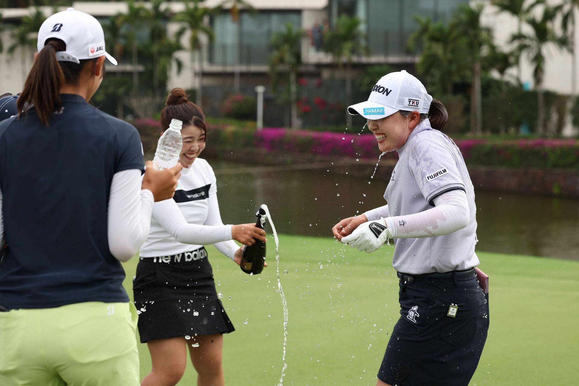 Rio Takeda is doused with champagne after winning the Blue Bay LPGA 2025 (Image Source: Getty)