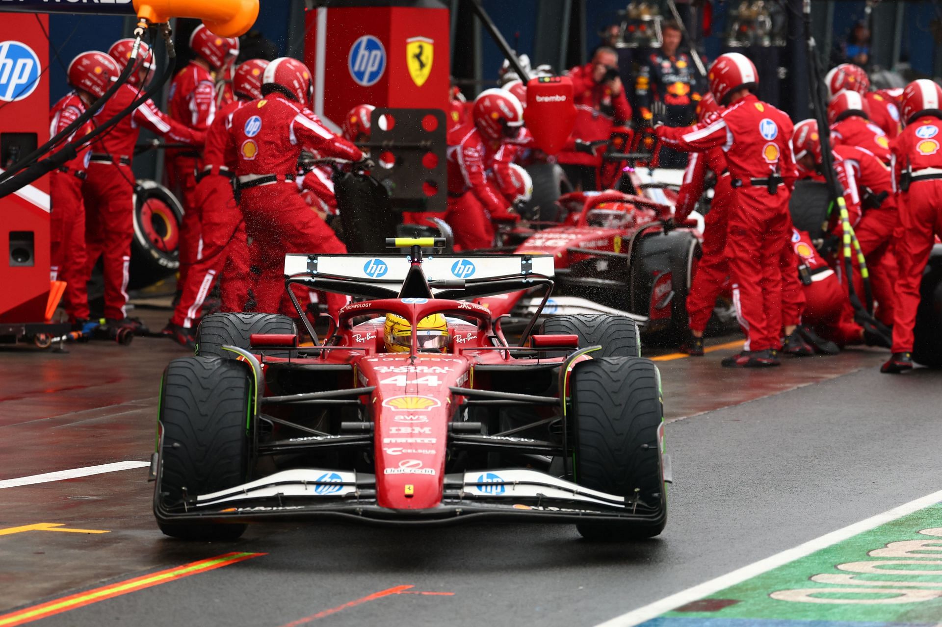 Lewis Hamilton and Charles Leclerc in the Ferrari pitbox during the F1 Grand Prix Of Australia - Source: Getty