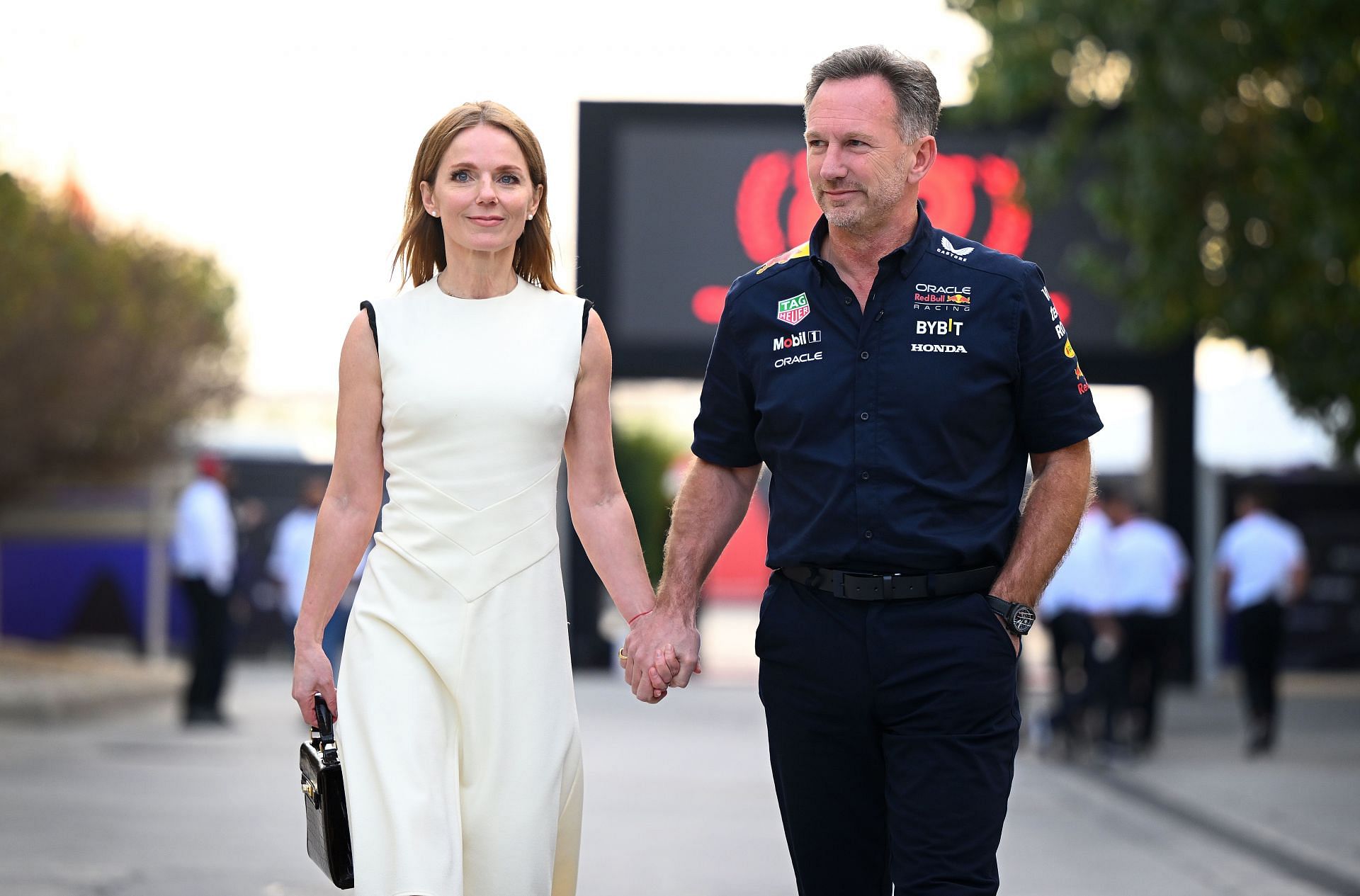 Christian Horner and Geri Horner walk in the Paddock holding hands before the Bahrain GP on March 02, 2024 - Source: Getty