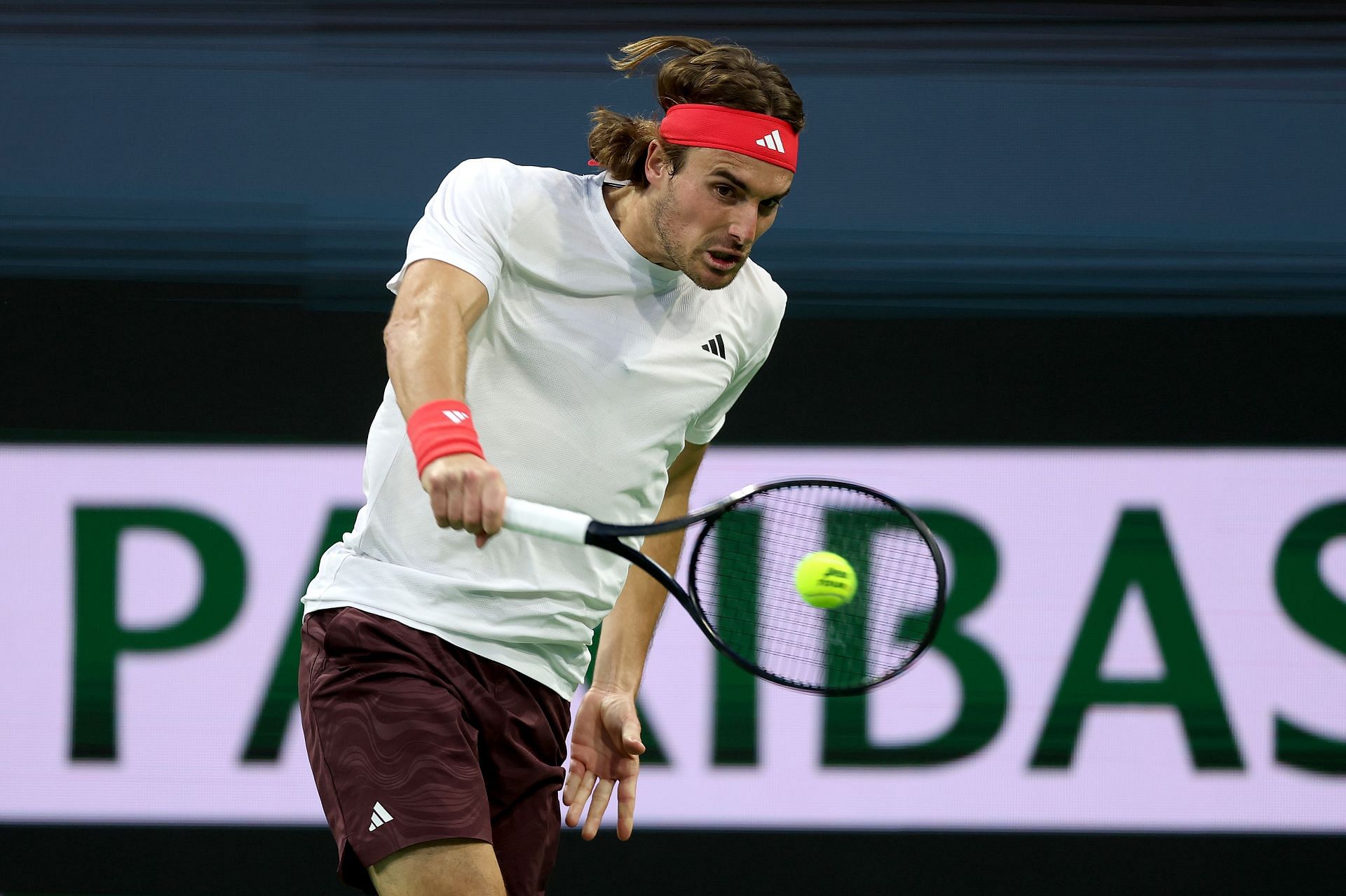 Stefanos Tsitsipas of Greece returns a shot to Thiago Seryboth Wild of Brazil during the BNP Paribas Open - Source: Getty