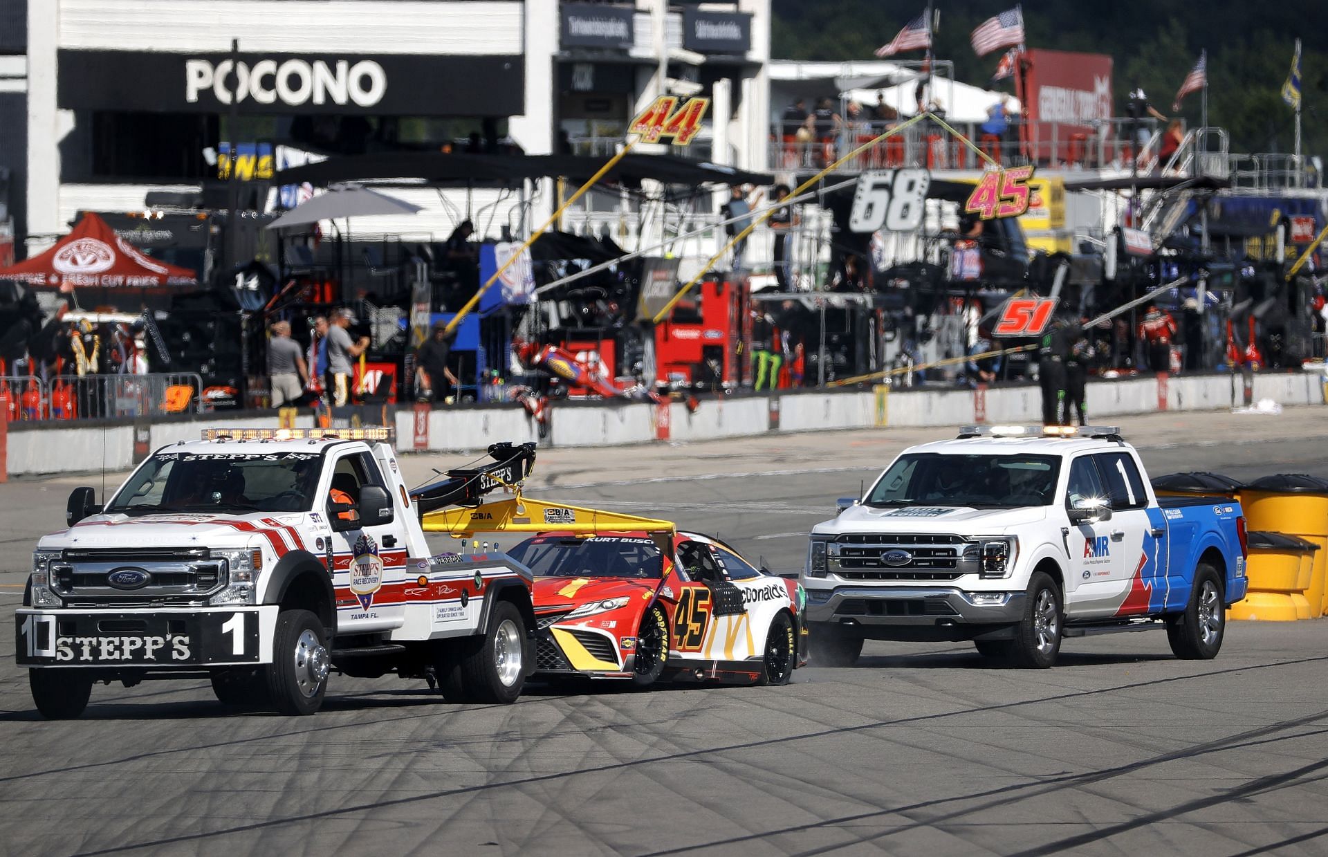 The #45 McDonald&#039;s Toyota, driven by Kurt Busch, is towed after the incident at Long Pond- Source: Getty