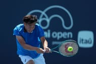 MIAMI GARDENS, FLORIDA - MARCH 19: Coleman Wong of Hong Kong returns a shot from Sumit Nagal of India during his men's singles match at the 2024 Miami Open - Source: Getty