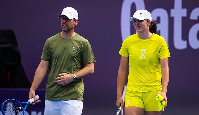 Iga Swiatek's coach Wim Fissette celebrates her Indian Wells semifinal progress with a post-victory picture with his children