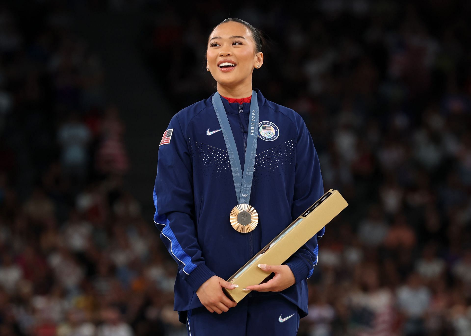 Suni Lee looks on from the podium after competing in the women&#039;s uneven bars final at the Olympic Games Paris 2024 - Source: Getty