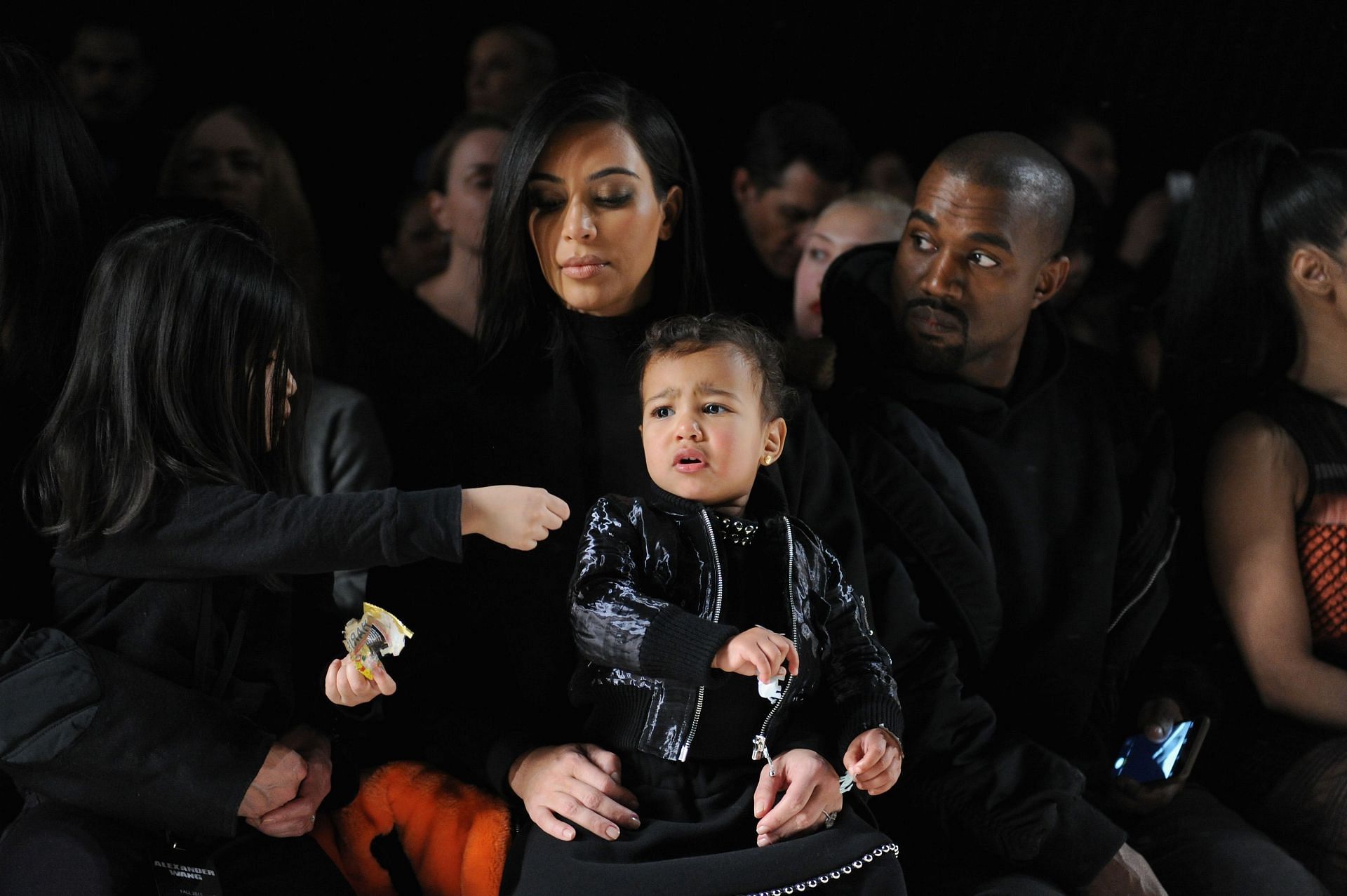 Kanye West and Kim Kardashian with their daughter North West attending the Alexander Wang show - Front Row - Mercedes-Benz Fashion Week Fall 2015 (Image via Getty)