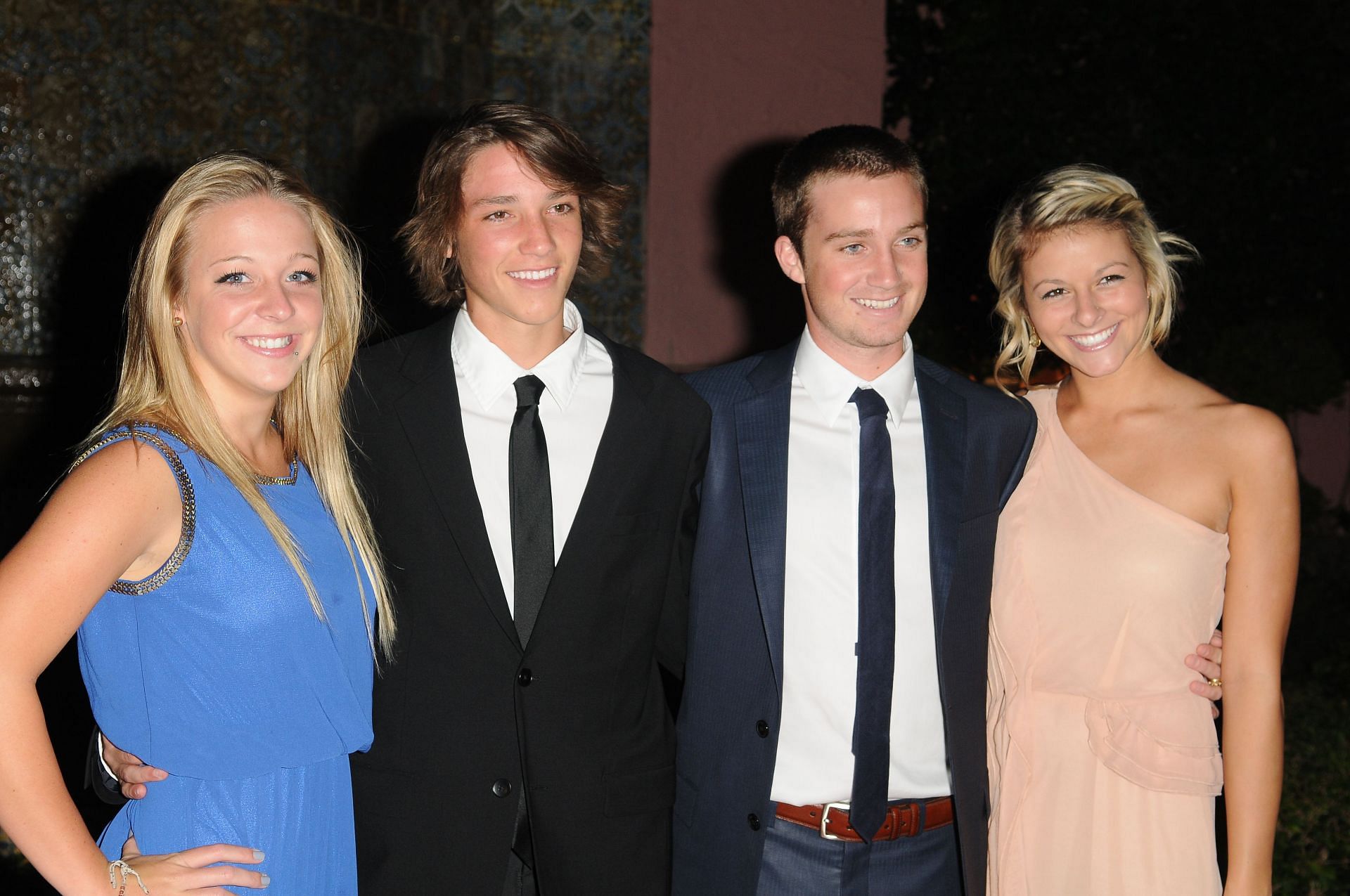 Chris Evert's son with their girlfriends in 2012. (Photo: Getty)