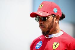 Lewis Hamilton reacts to the $1,000,000 selling prize for his trading card