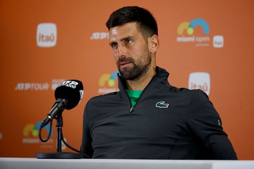 Novak Djokovic pictured speaking at a press conference [Image Source: Getty Images]
