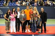 Pete Sampras (middle), his wife (to his right) with their sons at an exhibition event in 2009. (Photo: Getty)