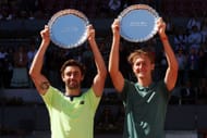Jordan Thompson of Australia and Sebastian Korda of United States pose for a photo with their Mutua Madrid Open Men's Doubles trophies. Source: Getty