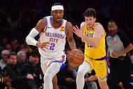 OKC Thunder guard Shai Gilgeous-Alexander moves the ball ahead of LA Lakers guard Austin Reaves at Crypto.com Arena. Photo Credit: Imagn
