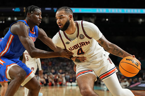 Auburn Tigers forward Johni Broome (4) drives to the basket against Florida Gators center Rueben Chinyelu (9) during the first half in the semifinals of the men's Final Four of the 2025 NCAA Tournament at the Alamodome. Photo: Imagn