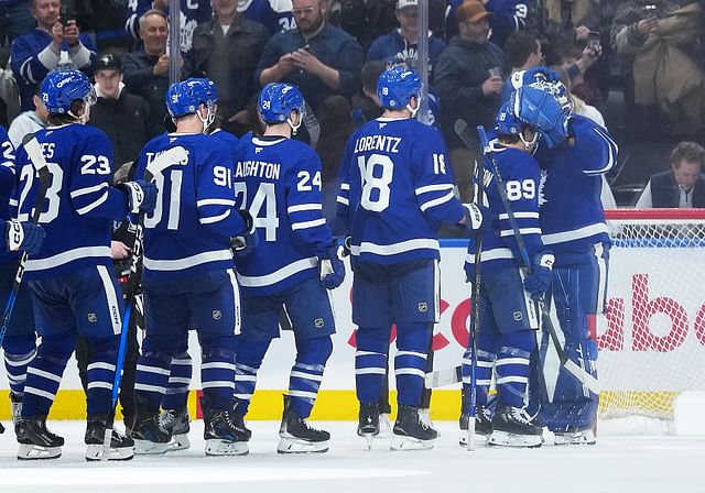 Apr 5, 2025; Toronto, Ontario, CAN; Toronto Maple Leafs left wing Nicholas Robertson (89) celebrates the win with goaltender Anthony Stolarz (41) against the Columbus Blue Jackets at the end of the third period at Scotiabank Arena. Mandatory Credit: Nick Turchiaro-Imagn Images - Source: Imagn