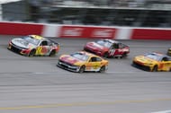 William Byron (24) and Joey Logano (22) lead during the Goodyear 400 at Darlington - Source: Imagn