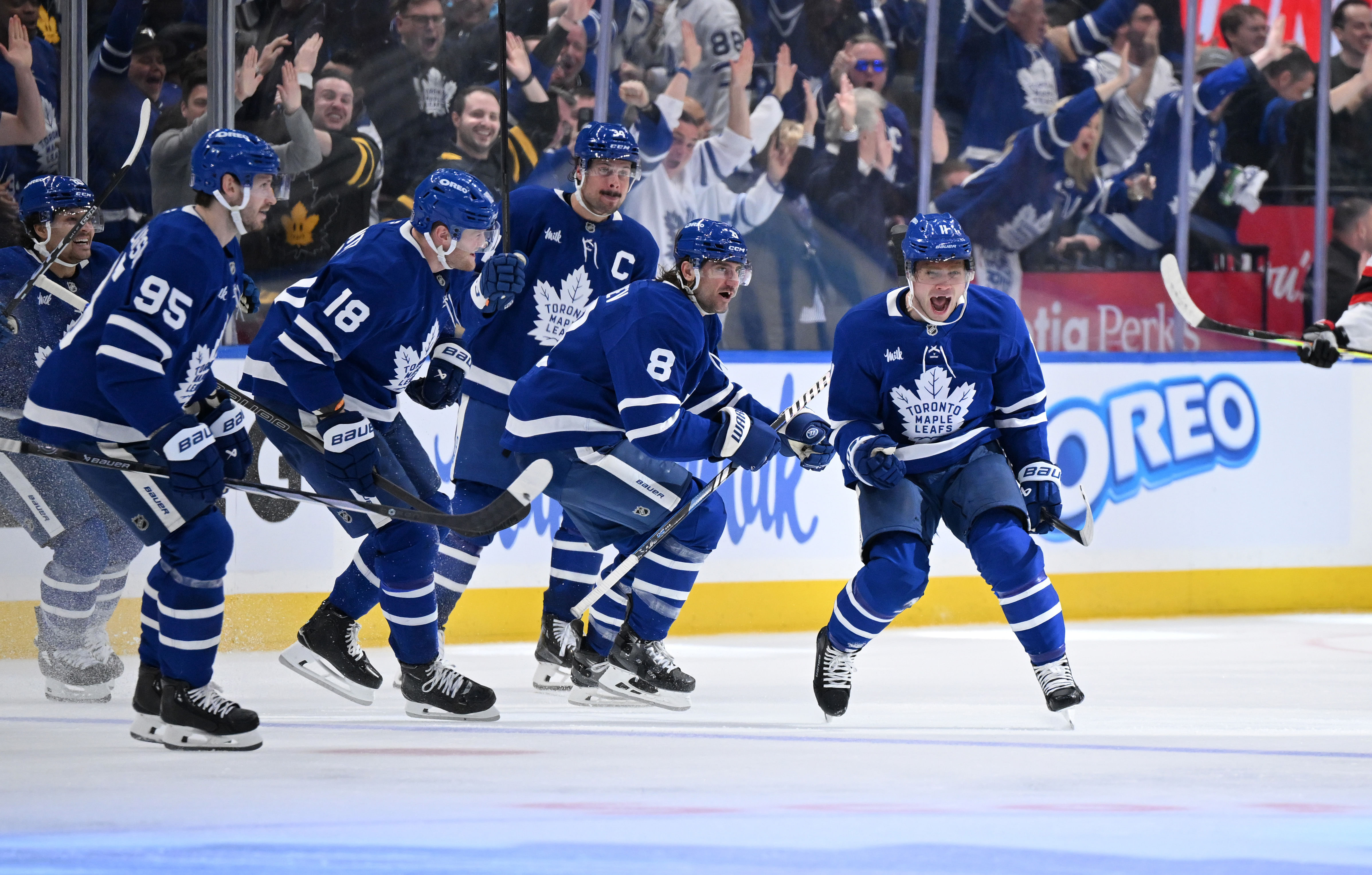 Apr 22, 2025; Toronto, Ontario, CAN; Toronto Maple Leafs forward Max Domi (11) celebrates with team mates after scoring the winning goal in overtime against the Ottawa Senators in game two of the first round of the 2025 Stanley Cup Playoffs at Scotiabank Arena. Mandatory Credit: Dan Hamilton-Imagn Images - Source: Imagn