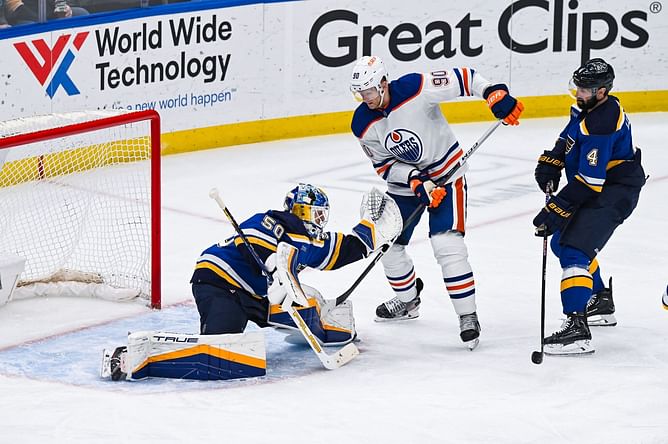 WATCH: Jordan Binnington lands a shot on Corey Perry from behind, Oilers-Blues scrum ensues