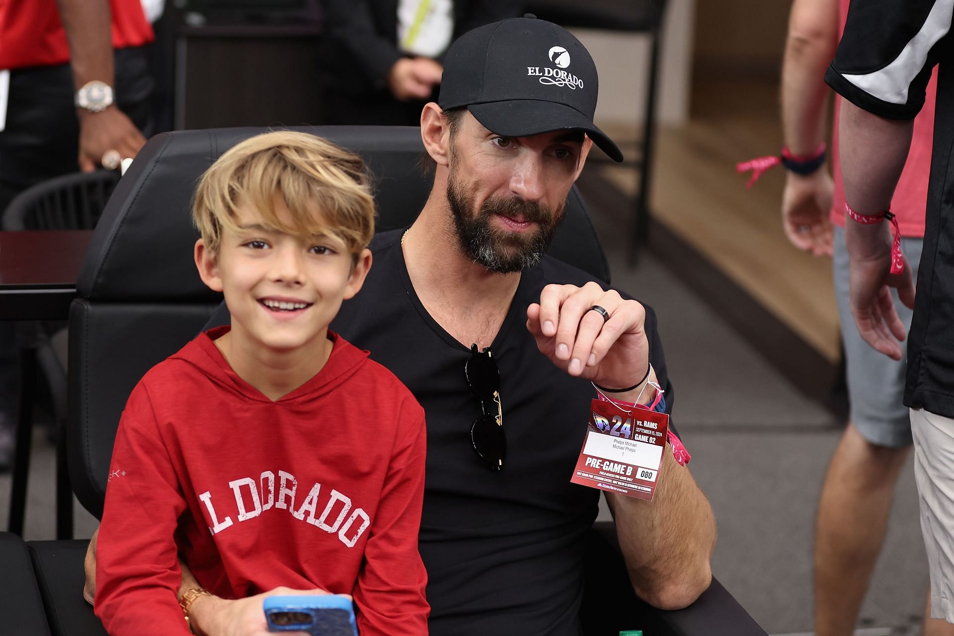 Michael Phelps with son boomer during the Los Angeles Rams v Arizona Cardinals - Source: Getty