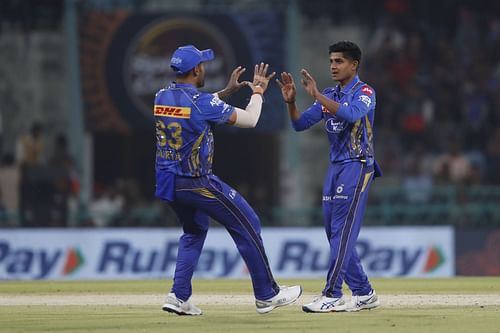 Vignesh Puthur (right) conceded 15 runs in the only over he bowled in MI's previous game against SRH. [P/C: Getty]