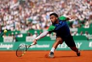 Fils plays a low backhand in the Rolex Monte-Carlo Masters - Day Six - Source: Getty