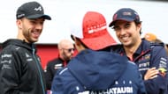 Pierre Gasly, Yuki Tsunoda, and Sergio Perez talk during the drivers parade before the F1 Grand Prix of Austria at Red Bull Ring on July 02, 2023 - Source: Getty