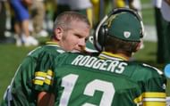 Brett Favre #4 of the Green Bay Packers talks to backup quarterback Aaron Rodgers #12 on the bench during NFL game action against the New Orleans Saints at Lambeau Field on September 17, 2006, in Green Bay, Wisconsin. - Source: Getty