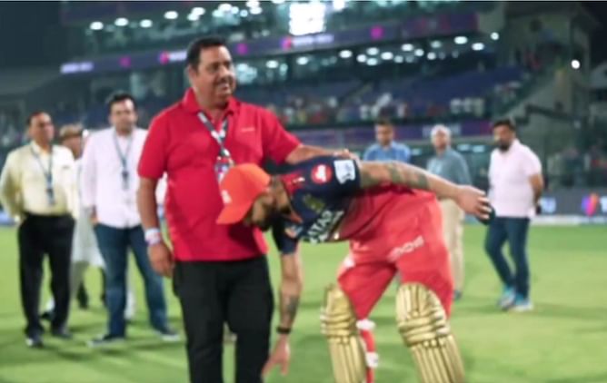 Virat Kohli touches feet of childhood coach in heartwarming moment after half-century in DC vs RCB IPL 2025 clash [Watch]
