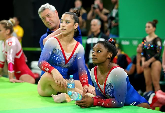 Simone Biles cheers for Aly Raisman as she enjoys Jordan Chiles and other gymnasts taking centre stage at the NCAA Gymnastics Championships finals