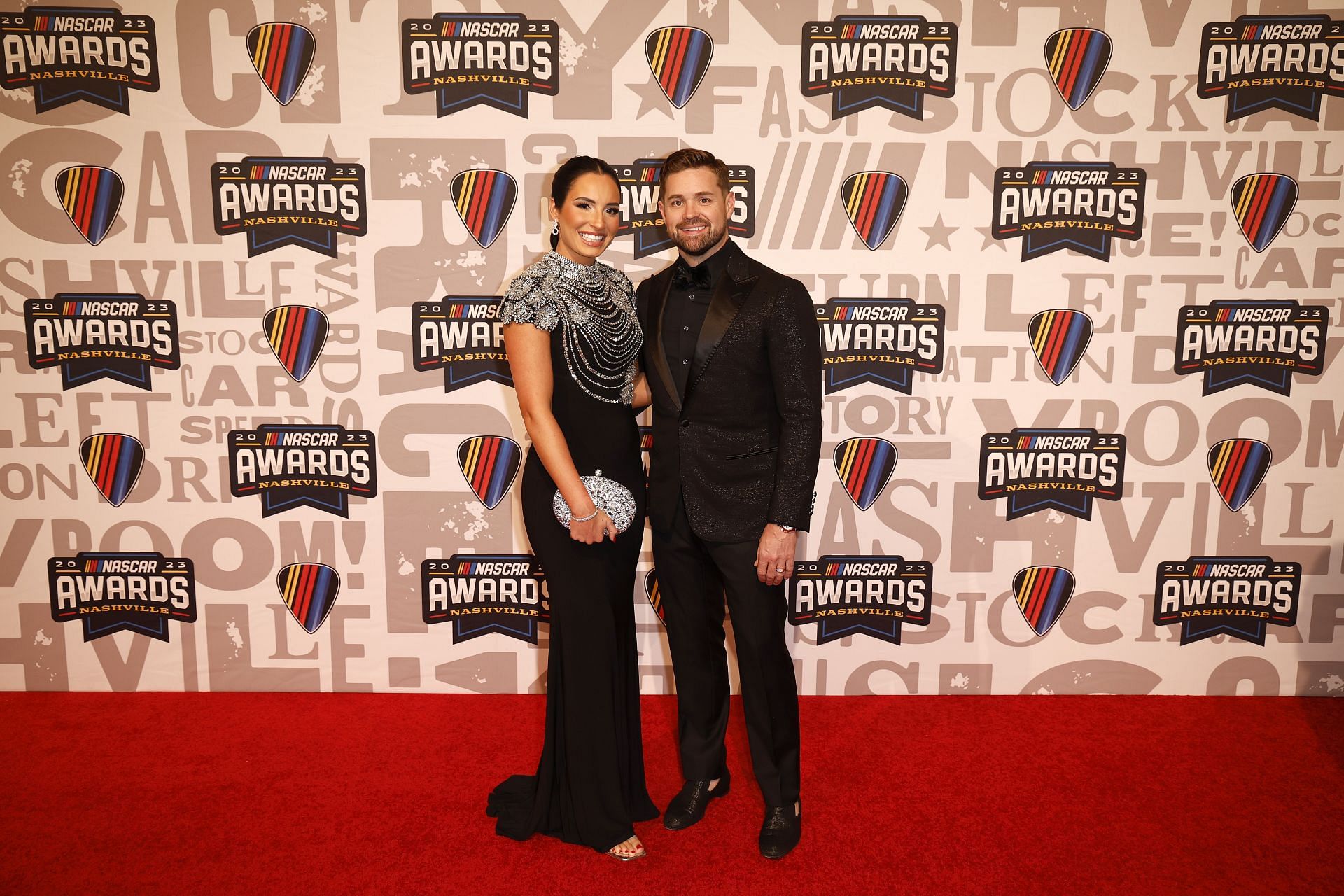  Ricky Stenhouse Jr. and wife, Madyson Stenhouse pose for photos on the red carpet prior to the NASCAR Awards and Champion Celebration at the Music City Center - Source: Getty