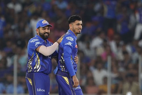 Rohit Sharma with Mujeeb Ur Rahman during 2025 IPL - Gujarat Titans v Mumbai Indians match - Source: Getty