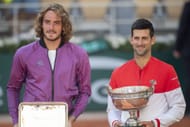 Stefanos Tsitsipas (left) and Novak Djokovic (right) during the 2021 French Open men's singles trophy presentation ceremony (Source: Getty)
